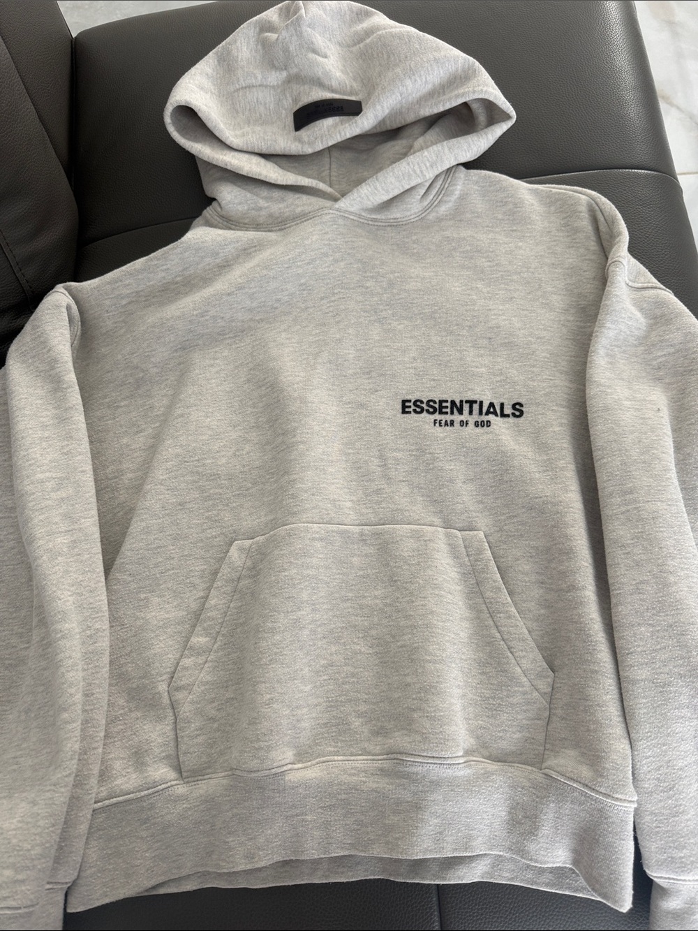 Fear of God Essentials Light Gray Pullover Hoodie with Black Logo